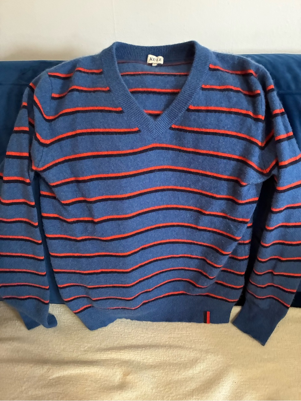 KULE Blue V-Neck Sweater with Orange & Navy Stripe Accents